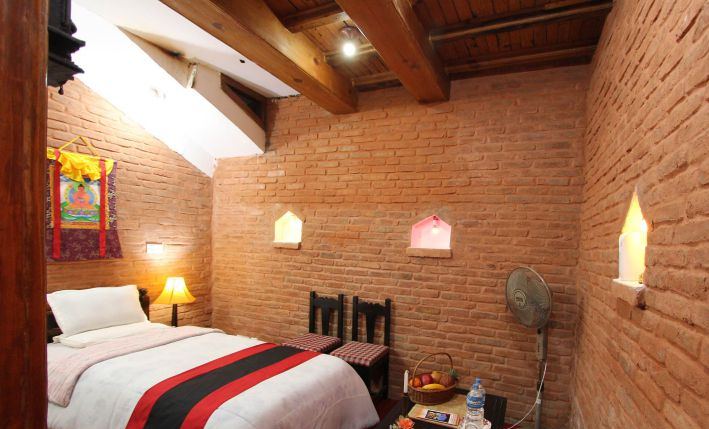 Standard room with brick walls